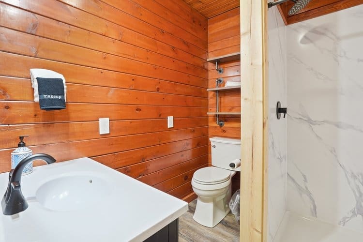 The master walk-in shower is located in the master bedroom.