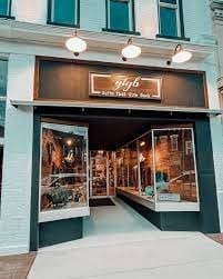 Storefront display of Gifts That Give Back shop