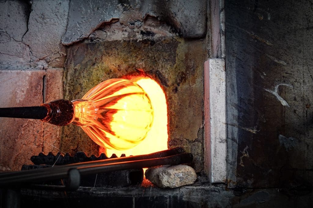 An image of glassblowing in progress.